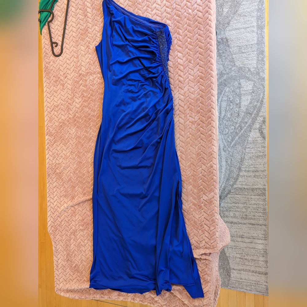 Royal blue asymmetrical evening gown with hand sewn beads and thigh slit